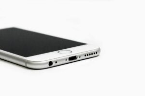 close up of mobile phone against white background